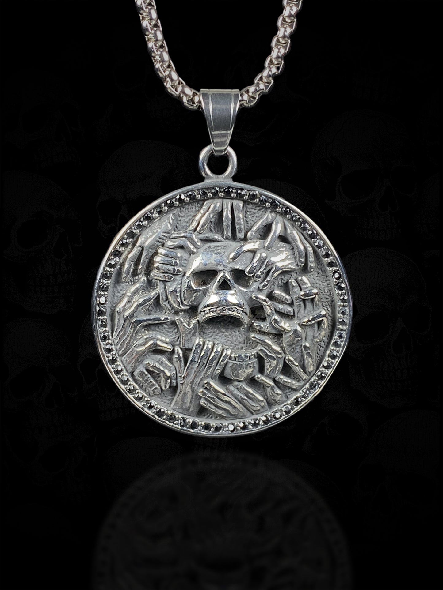 Grasping Hands Skull Necklace